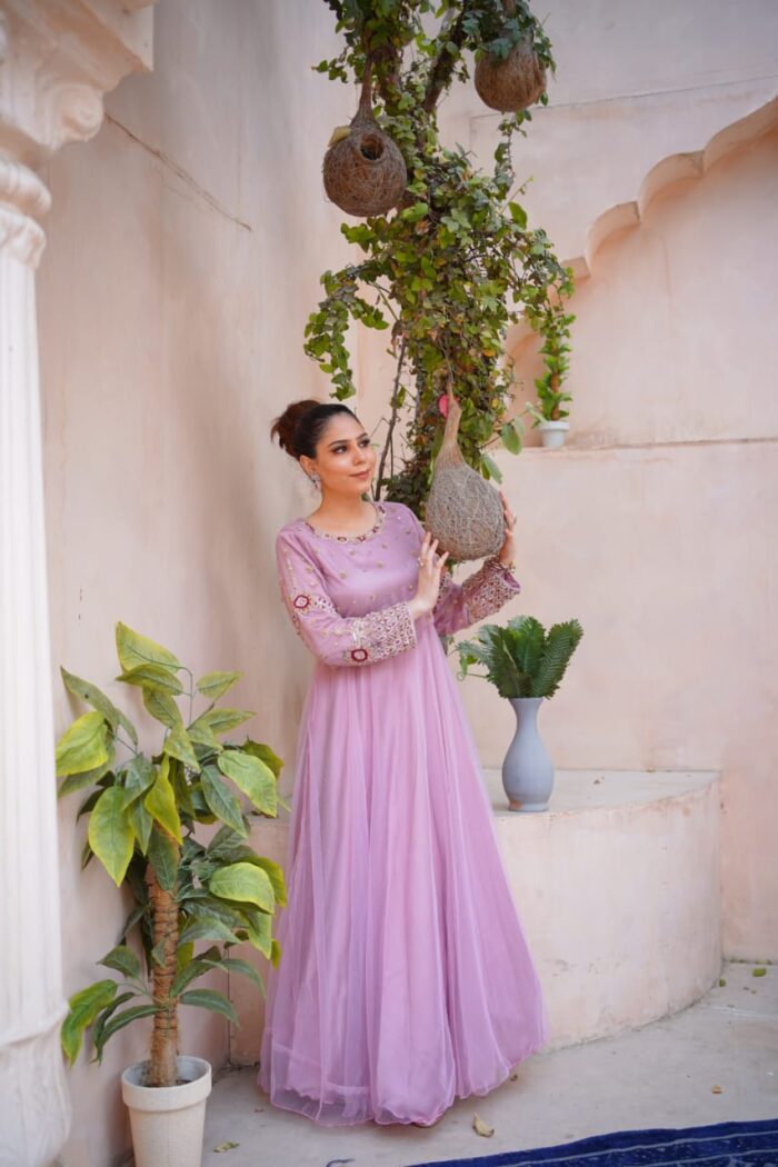 Designed by Sara herself, this signature bridal dress reflects grandeur with gold-thread embroidery, zardozi, and a flowing silhouette.